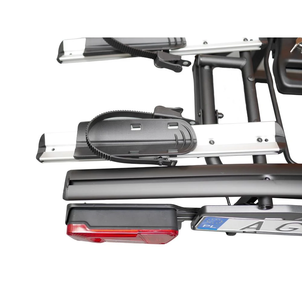 Zbliżenie aluminiowej szyny i korytka koła bagażnika Aguri Active E-Bike 2 PLUS z paskiem zaciskowym