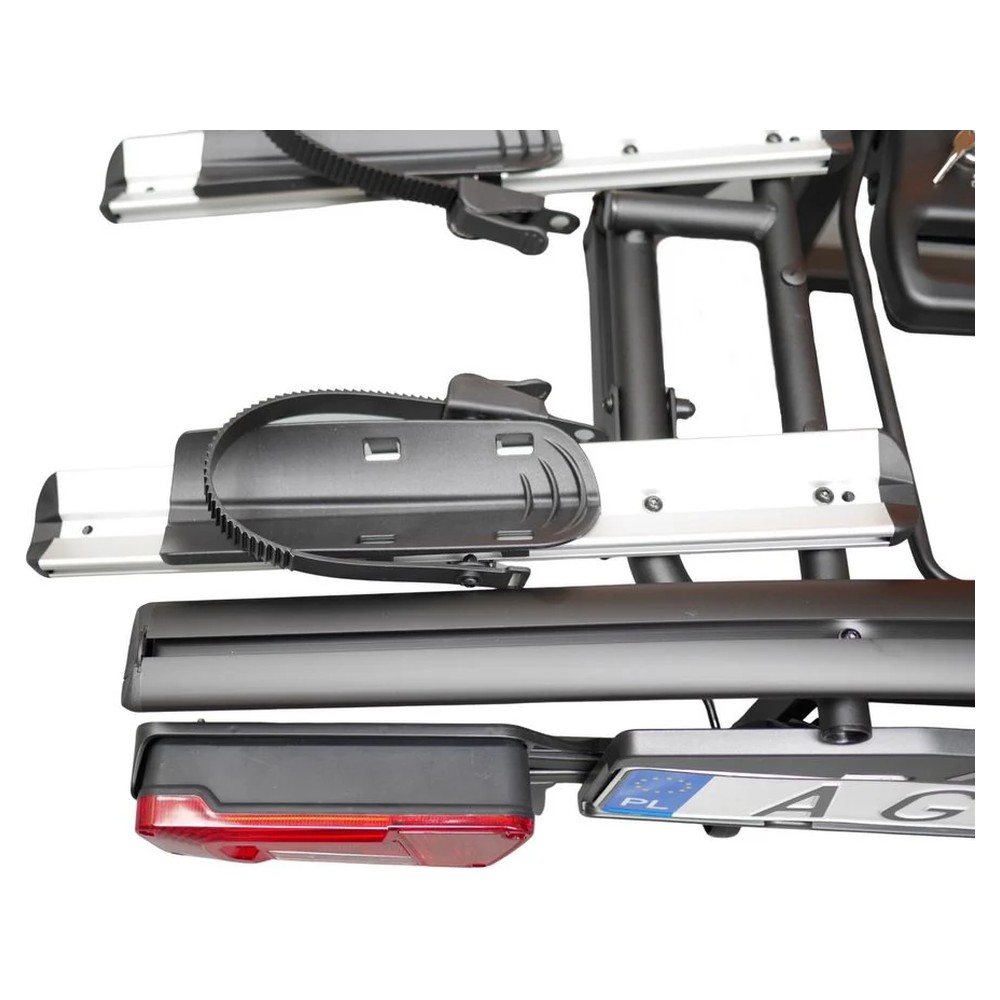 Zbliżenie aluminiowej szyny i korytka koła bagażnika Aguri Active E-Bike 2 PLUS z paskiem zaciskowym